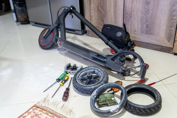 Electric scooter tire repair. Installation of a flat tire at home after patching it with a repair...