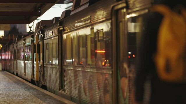A mooving Train Next to a Platform