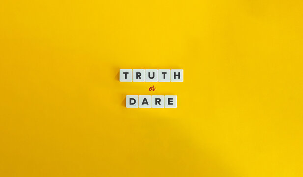 Truth or Dare Text on Block Letter Tiles on Yellow Background. Minimalist Aesthetics.