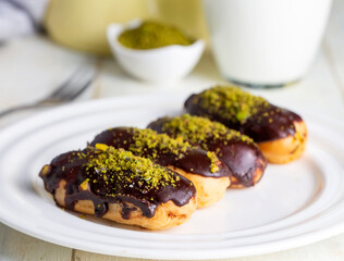 Traditional french eclairs with chocolate.