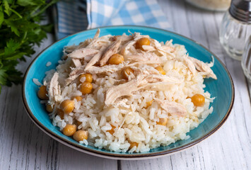 Traditional delicious Turkish food; Rice with chickpeas and chicken (Turkish name; Tavuklu nohutlu pilav or pilaf)
