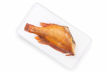Smoked fish on a white plate from a fish shop
