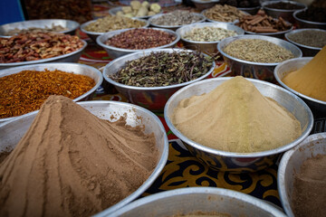 Pyramids of spices and color powder on Egyptian market in Aswan Egypt
