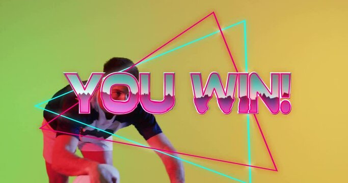 Animation of you win text over neon pattern caucasian rugby player