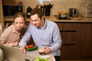 Young couple having coffee break at home office