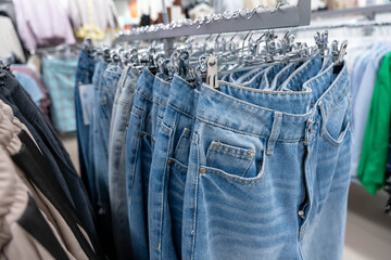 Blue Jeans Hanging on a Hanger in a Stylish Fashion Store Display