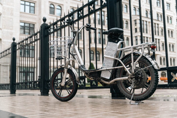 Modern electric bicycle parked on city street for delivery service