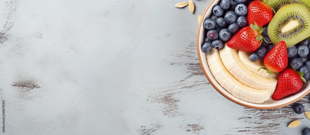 Poster Nutritious bowl of oats with fruits and chia Copy space image Place for adding text or design