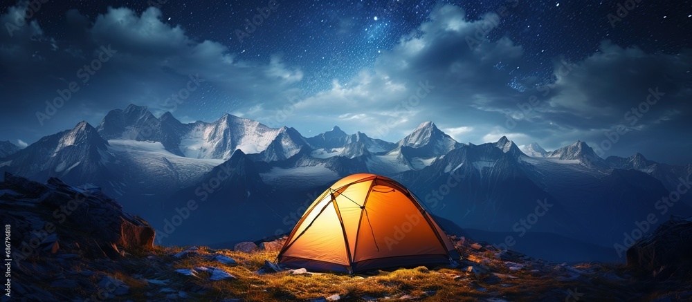 Wall mural mountain tent illuminated by starry sky copy space image place for adding text or design