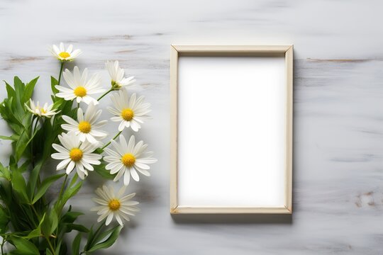 template blank picture frame mockup on white wooden background surrounded by daisies flowers