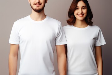 Fototapeta premium closeup of young woman and man in blank white shirt mockup. Copy space design for branding clothes. White t shirt design fashion concept