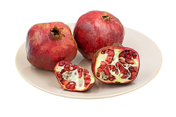 Pomes of pomegranates (Punica granatum) on a plate