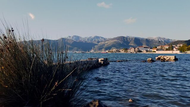 View of Yachts in Porto Montenegro, with mountains in the background. Shot from the Zupa waterfront. 4k