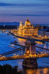 Fototapeta na wymiar Hungary, Budapest, tranquil evening in the city with lit up Hungarian Parliament and Chain Bridge on Danube River