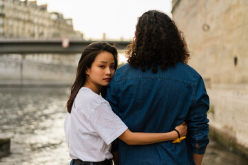 France, Paris, young couple in love at river Seine