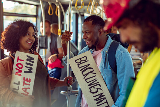 Activists with 'Black Lives Matter' Signs on Public Transportation