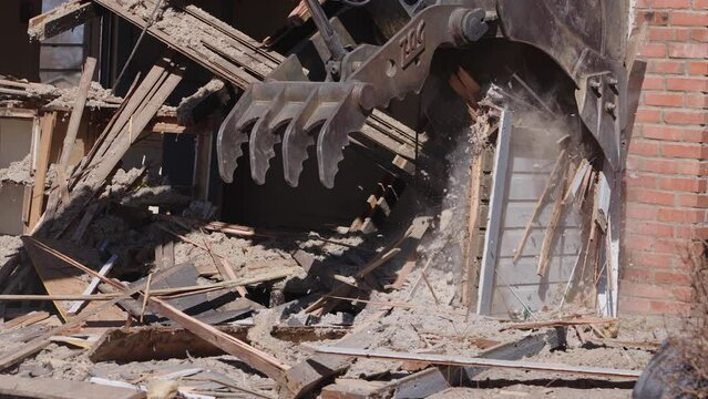 Abandoned house being demolished