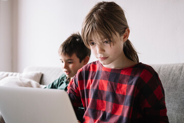 Girl in the living room using laptop