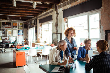 Creative Female Team Meeting in Modern Office Space