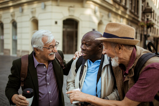Senior male tourists walking downtown