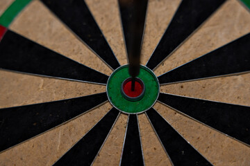 Bull's Eye. Vintage style photo from three darts hit the double Bull's Eye. Dart world championship.