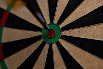 Bull's Eye. Vintage style photo from three darts hit the double Bull's Eye. Dart world championship.