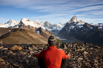 Fototapeta na wymiar Man looking at Fitz Roy and Cerro Torre mountains, Los Glaciares National Park, Patagonia, Argentina
