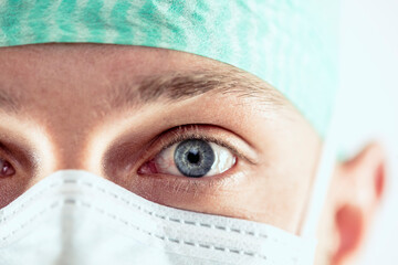 Surgeon with blue eyes, close-up