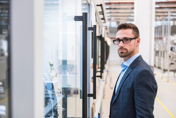 Portrait of confident man in factory shop floor