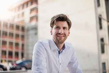 Portrait of smiling businessman in the city