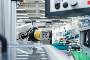 Arm of assembly robot functioning inside modern factory, Stuttgart, Germany
