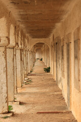 Covered archway in an ancient monastery.  Sanctuary of Our Lady of Cape Espichel, in Portugal
