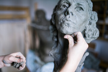 Female student forming chin of bust