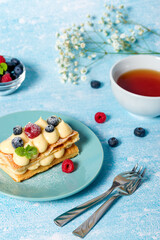 Millefeuille cake. Dessert millefeuille of puff pastry layered with custard cream, raspberries, blueberries. Photo for advertising confectionery products. Close-up