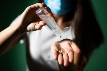 Woman applying sanitizer during COVID-19