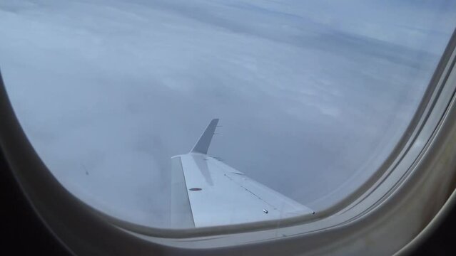 Airplane Window View While Turning Sideways (private jet embraer phenom 300)