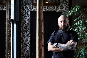 Portrait of tattoo artist in studio