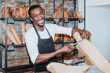 Smiling man working in a bakery
