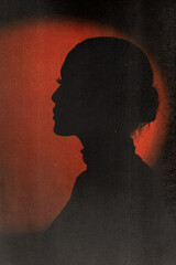 Beauty, fashion, style and make-up concept. Woman profile black silhouette portrait in red...