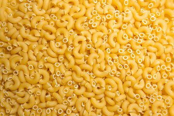 Uncooked Chifferi Rigati Pasta: A Culinary Canvas of Chifferi Rigati, Creating a Lively and Textured Background for Gourmet Cooking. Dry Pasta. Raw Macaroni - Top View, Flat Lay
