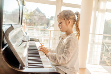 Girl at home playing piano