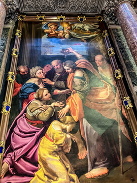 Naples, Italy, September 28, 2023:  Chapel of San Gennaro, Naples Duomo. Minor altar, oil painting on copper by Domenichino 1640. Miracle of the infirm healed by the oil of St. Gennaro.