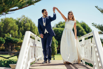 Bridal couple enjoying their wedding day in a park
