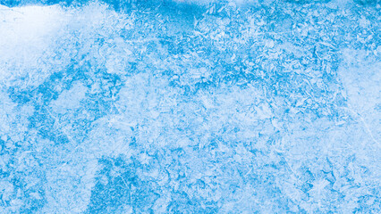 Aerial view of frozen lake. Blue ice from above. Background or texture concept.