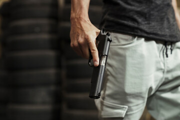 Close-up of man holding a pistol