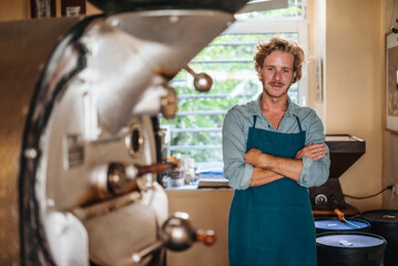 Portrait of confident coffee roaster in his shop