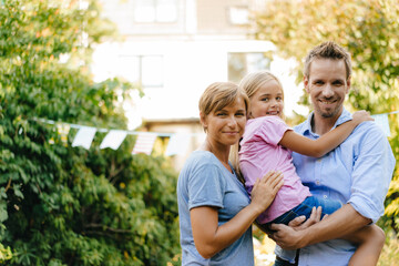 Portrait of happy family in garden
