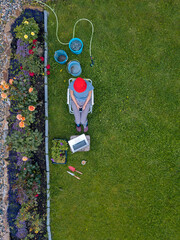 Aerial view of woman sitting in garden