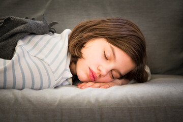 Portrait of girl sleeping on couch