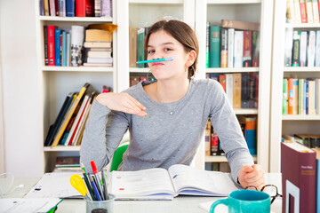 Portrait of schoolgirl making faces